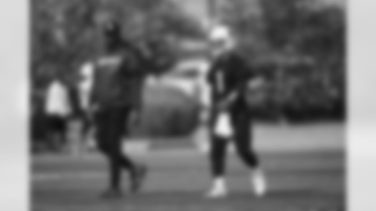 Arizona Cardinals quarterback Kyler Murray (1) and Arizona Cardinals Quarterbacks Coach Israel Woolfork during practice at the Dignity Health Training Facility on Thursday, November 30, 2023 in Tempe, AZ.