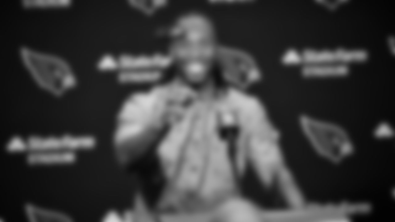 Larry Fitzgerald has some fun with reporters after a game in 2018.