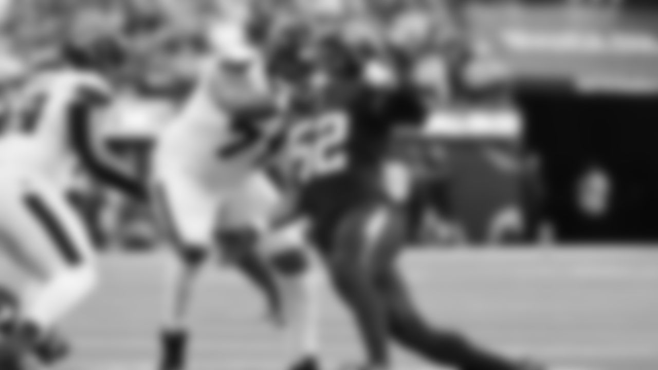 Houston Texans offensive tackle Tytus Howard (71) grabs Los Angeles Chargers linebacker Khalil Mack (52) during the first half of an NFL football game Saturday, Dec. 27, 2025, in Inglewood, Calif. (AP Photo/Kevork Djansezian)