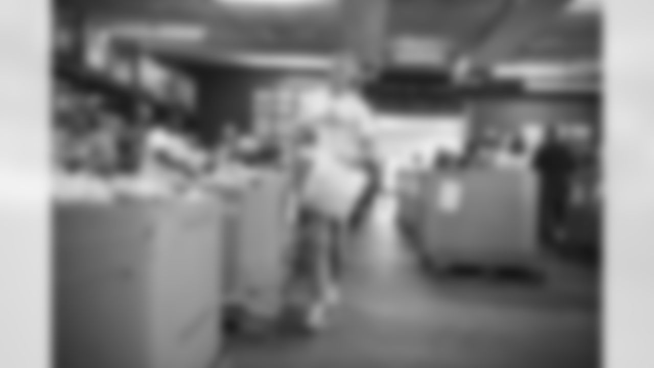 The Arizona Cardinals Women's Club packs emergency food bags at United Food Bank on Thursday, November 16, 2023 in Mesa, AZ.