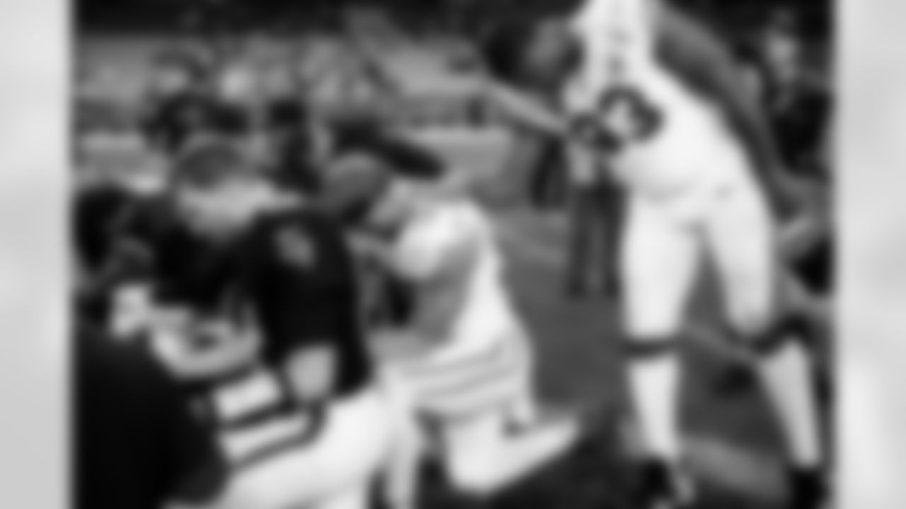 Arizona Cardinals defensive lineman Calais Campbell (93) and Arizona Cardinals tight end Trey McBride (85) during the Week 16 regular season game between the Arizona Cardinals and the Atlanta Falcons on Sunday, Dec. 21, 2025 at State Farm Stadium.