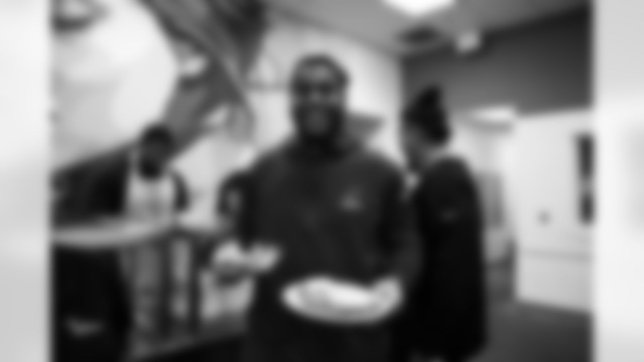 The Arizona Cardinals defensive line serves food at Phoenix Rescue Mission on Tuesday, Sep. 17, 2024 in Phoenix, AZ.