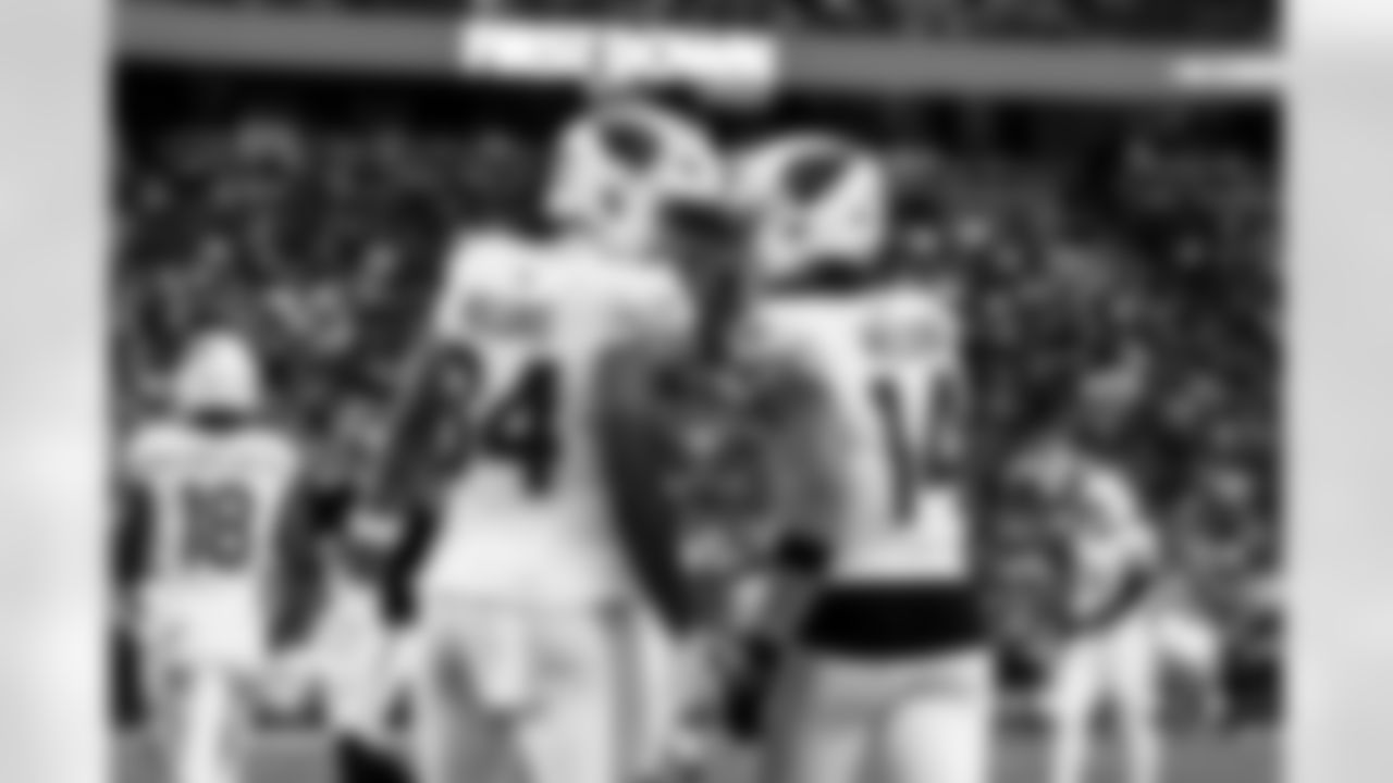 Arizona Cardinals tight end Elijah Higgins (84) and Arizona Cardinals wide receiver Michael Wilson (14) during the Week 16 regular season game between the Arizona Cardinals and the Atlanta Falcons on Sunday, Dec. 21, 2025 at State Farm Stadium.