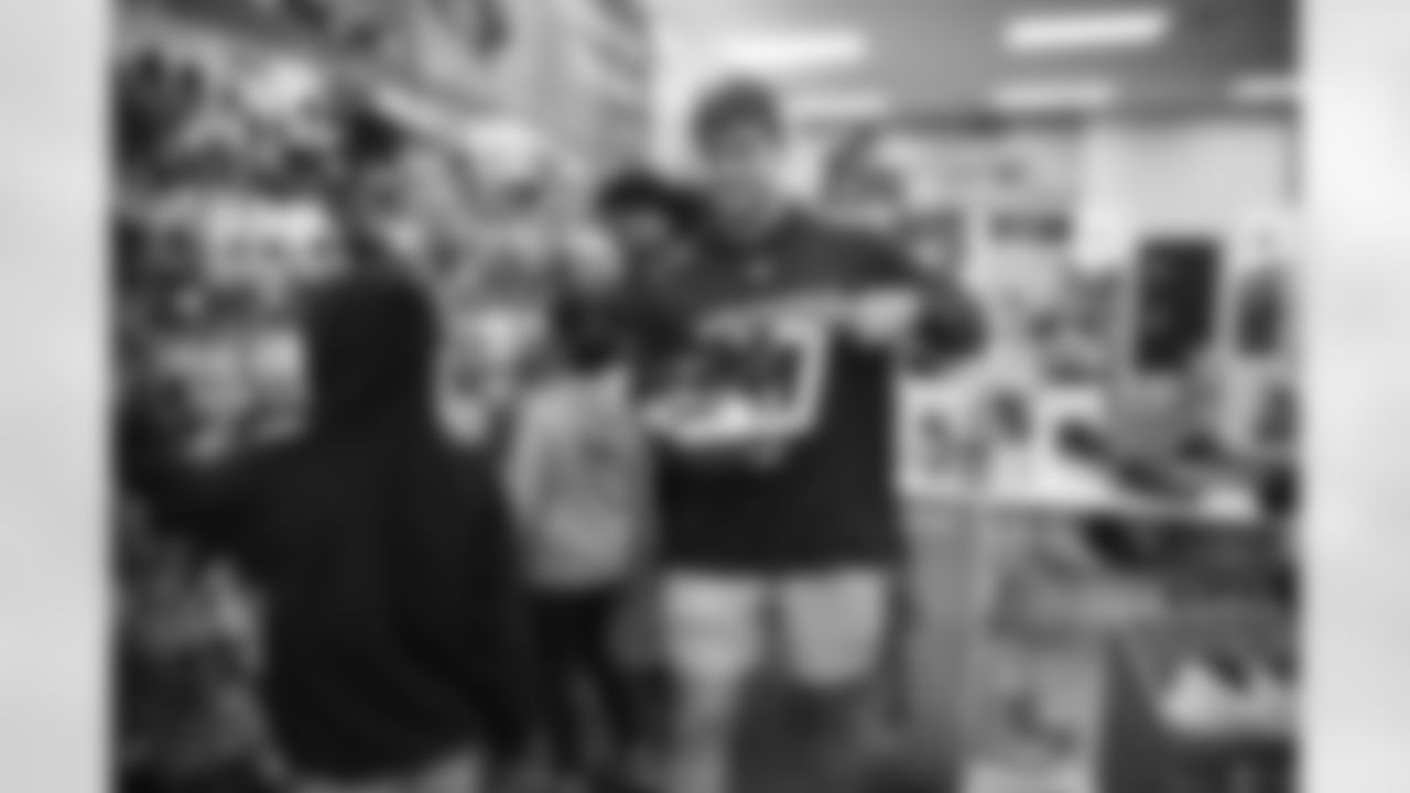 Arizona Cardinals tight end Trey McBride (85) hosts a "Catch for the Holidays" shopping spree for children at Scheel's on Tuesday, December 19, 2023 in Chandler, AZ.
