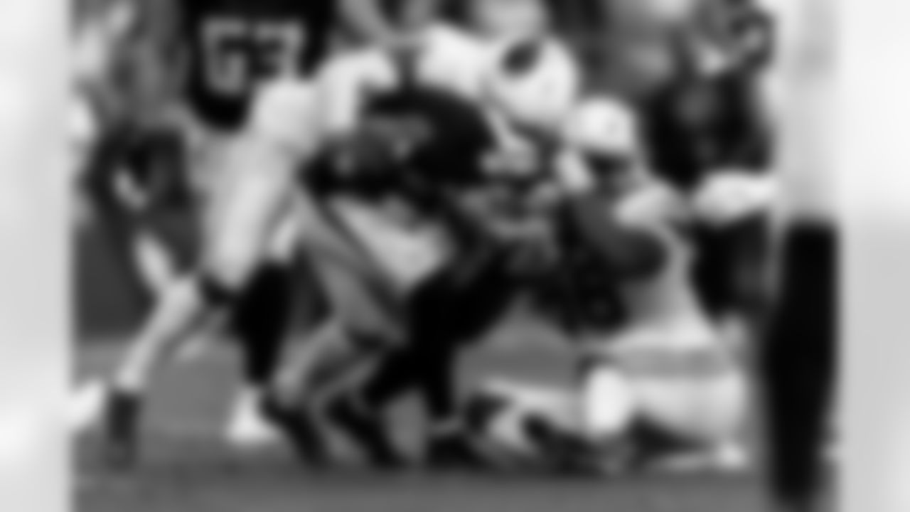 Arizona Cardinals linebacker Akeem Davis-Gaither (27) and Arizona Cardinals defensive lineman Darius Robinson (56) during the Week 16 regular season game between the Arizona Cardinals and the Atlanta Falcons on Sunday, Dec. 21, 2025 at State Farm Stadium.