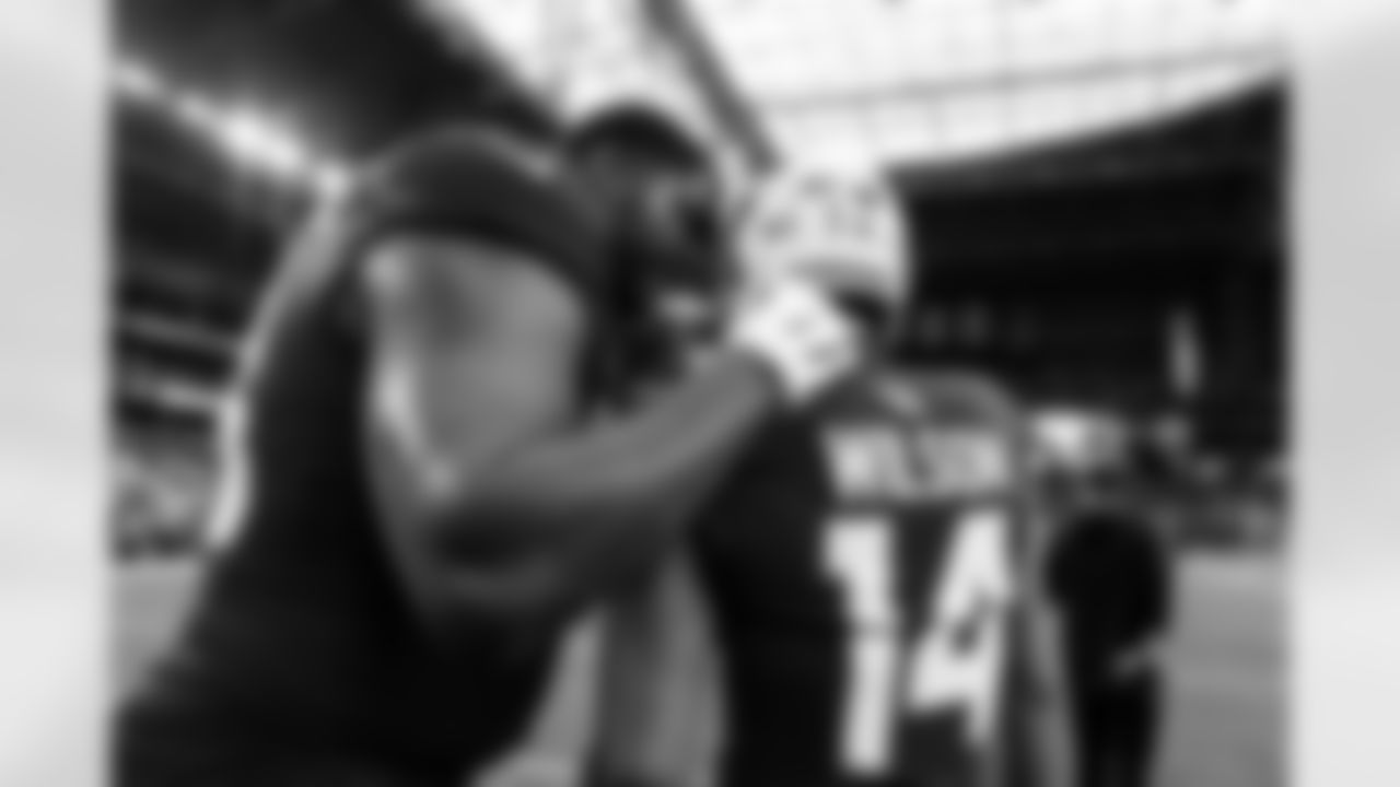 Arizona Cardinals defensive lineman Calais Campbell (93) and Arizona Cardinals wide receiver Michael Wilson (14) during the Week 12 regular season game between the Arizona Cardinals and the Jacksonville Jaguars on Sunday, Nov. 23, 2025 at State Farm Stadium.