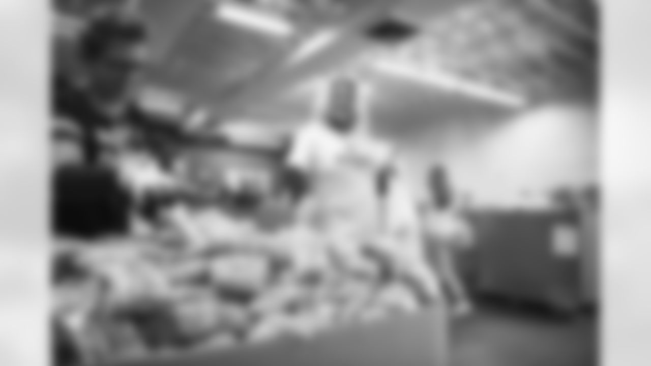 The Arizona Cardinals Women's Club packs emergency food bags at United Food Bank on Thursday, November 16, 2023 in Mesa, AZ.