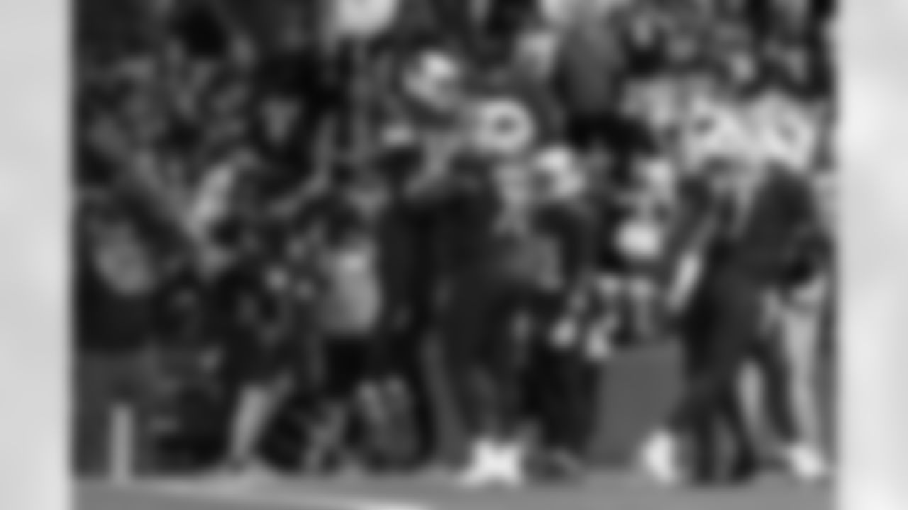 Arizona Cardinals wide receiver Michael Wilson (14) and Arizona Cardinals offensive lineman Paris Johnson Jr. (70) during the Week 14 regular season game between the Arizona Cardinals and the Los Angeles Rams on Sunday, Dec. 7, 2025 at State Farm Stadium.