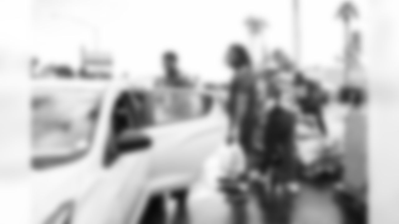 Arizona Cardinals offensive lineman Kelvin Beachum (68) and Arizona Cardinals offensive lineman Paris Johnson Jr. (70) host a food distribution for families at the Eisenhower Center for Innovation in collaboration with United Food Bank on Tuesday, Nov. 18, 2025 in Mesa, AZ.