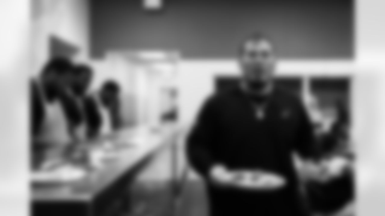 The Arizona Cardinals defensive line serves food at Phoenix Rescue Mission on Tuesday, Sep. 17, 2024 in Phoenix, AZ.