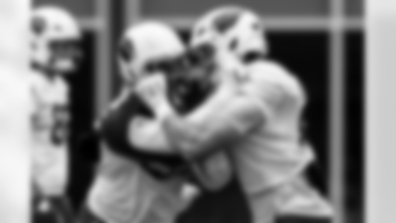 Arizona Cardinals tight end Travis Vokolek (81) and Arizona Cardinals linebacker Jordan Burch (52) during practice at the Dignity Health Training Facility on Thursday, Oct. 9, 2025 in Tempe, AZ.