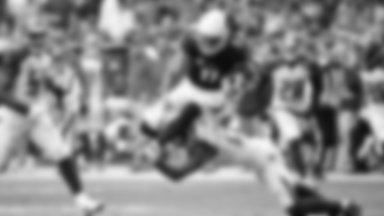 Larry Fitzgerald hurdles a defender during a 2017 game against the Buccaneers.