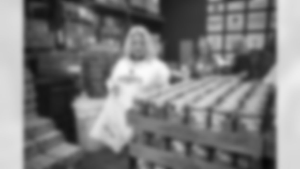 The Arizona Cardinals Women's Club packs emergency food bags at United Food Bank on Thursday, November 16, 2023 in Mesa, AZ.