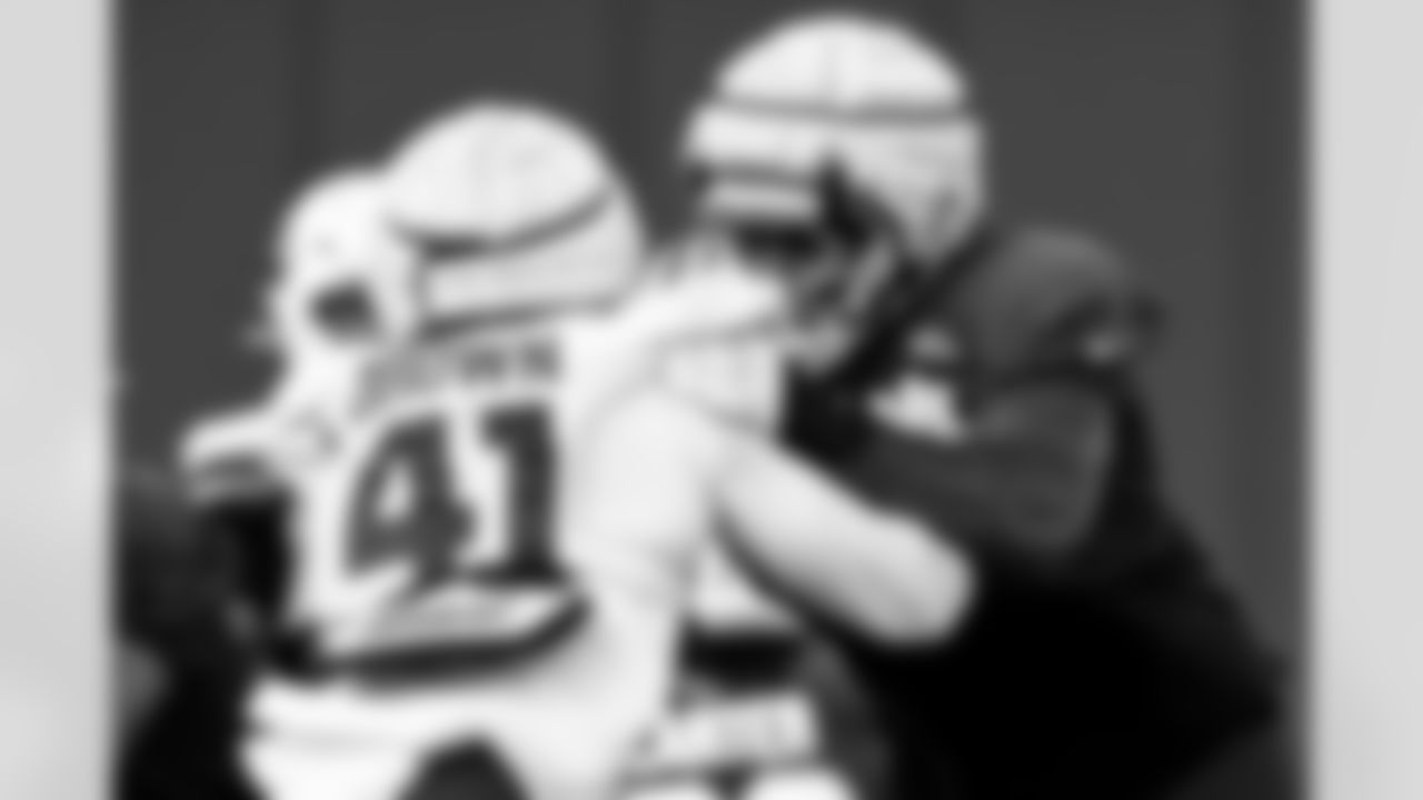 Arizona Cardinals offensive lineman Paris Johnson Jr. (70) and Arizona Cardinals linebacker Elliott Brown (41) during practice at the Dignity Health Training Facility on Thursday, Nov. 20, 2025 in Tempe, AZ.