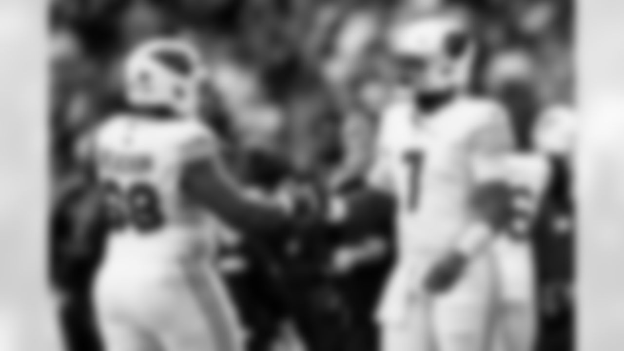 Arizona Cardinals quarterback Jacoby Brissett (7) and Arizona Cardinals offensive lineman Kelvin Beachum (68) during the Week 16 regular season game between the Arizona Cardinals and the Atlanta Falcons on Sunday, Dec. 21, 2025 at State Farm Stadium.