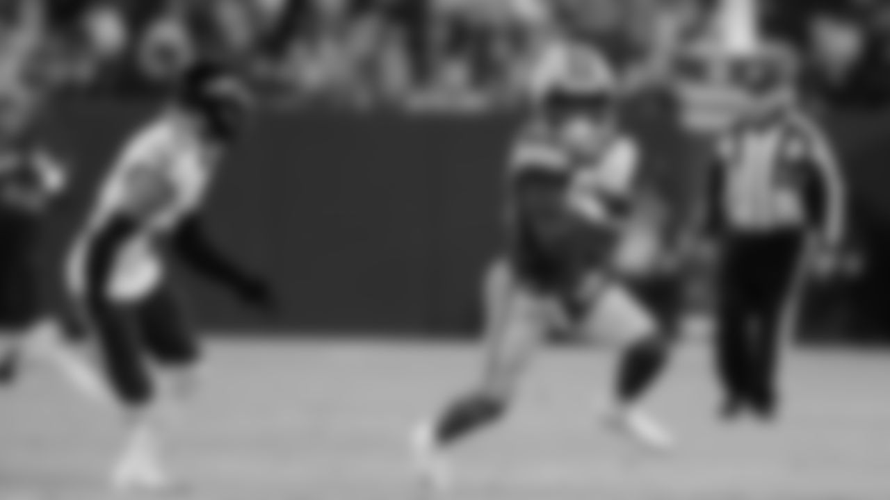 Green Bay Packers wide receiver Romeo Doubs (87) runs past Baltimore Ravens safety Alohi Gilman (12) during an NFL football game between the Green Bay Packers and Baltimore Ravens Saturday, Dec. 27, 2025, in Green Bay, Wis. (AP Photo/Matt Ludtke)