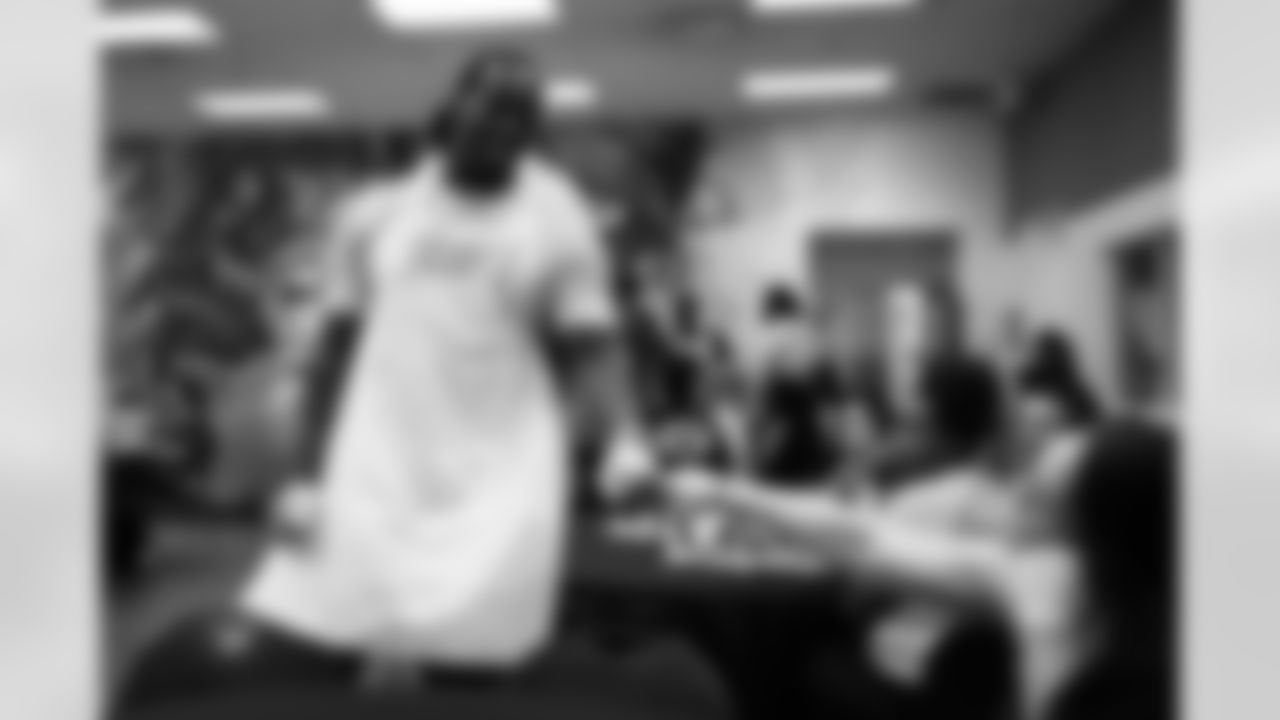 The Arizona Cardinals defensive line serves food at Phoenix Rescue Mission on Tuesday, Sep. 17, 2024 in Phoenix, AZ.