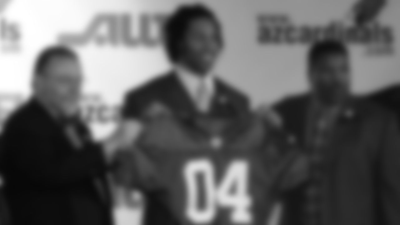 (From left) Owner Bill Bidwill, Larry Fitzgerald and coach Dennis Green after Fitzgerald was drafted in 2004.