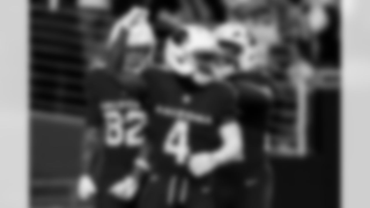 Arizona Cardinals wide receiver Greg Dortch (4) , Arizona Cardinals wide receiver Andre Baccellia (82) and Arizona Cardinals running back Michael Carter (22) during the Week 12 regular season game between the Arizona Cardinals and the Jacksonville Jaguars on Sunday, Nov. 23, 2025 at State Farm Stadium.