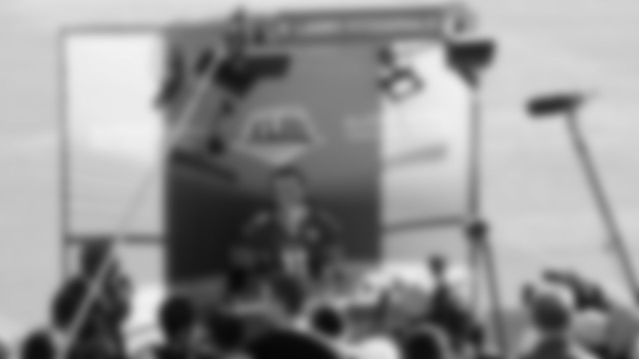 Larry Fitzgerald speaks to reported at Super Bowl media day.