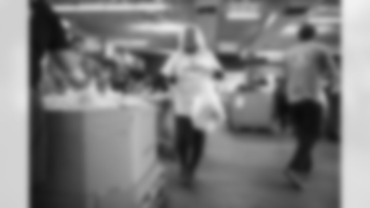 The Arizona Cardinals Women's Club packs emergency food bags at United Food Bank on Thursday, November 16, 2023 in Mesa, AZ.