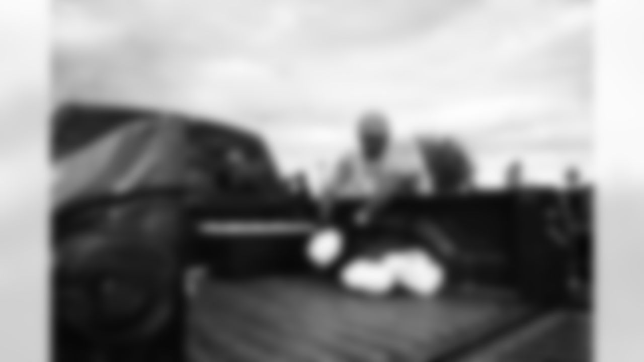 Arizona Cardinals offensive lineman Kelvin Beachum (68) and Arizona Cardinals offensive lineman Paris Johnson Jr. (70) host a food distribution for families at the Eisenhower Center for Innovation in collaboration with United Food Bank on Tuesday, Nov. 18, 2025 in Mesa, AZ.