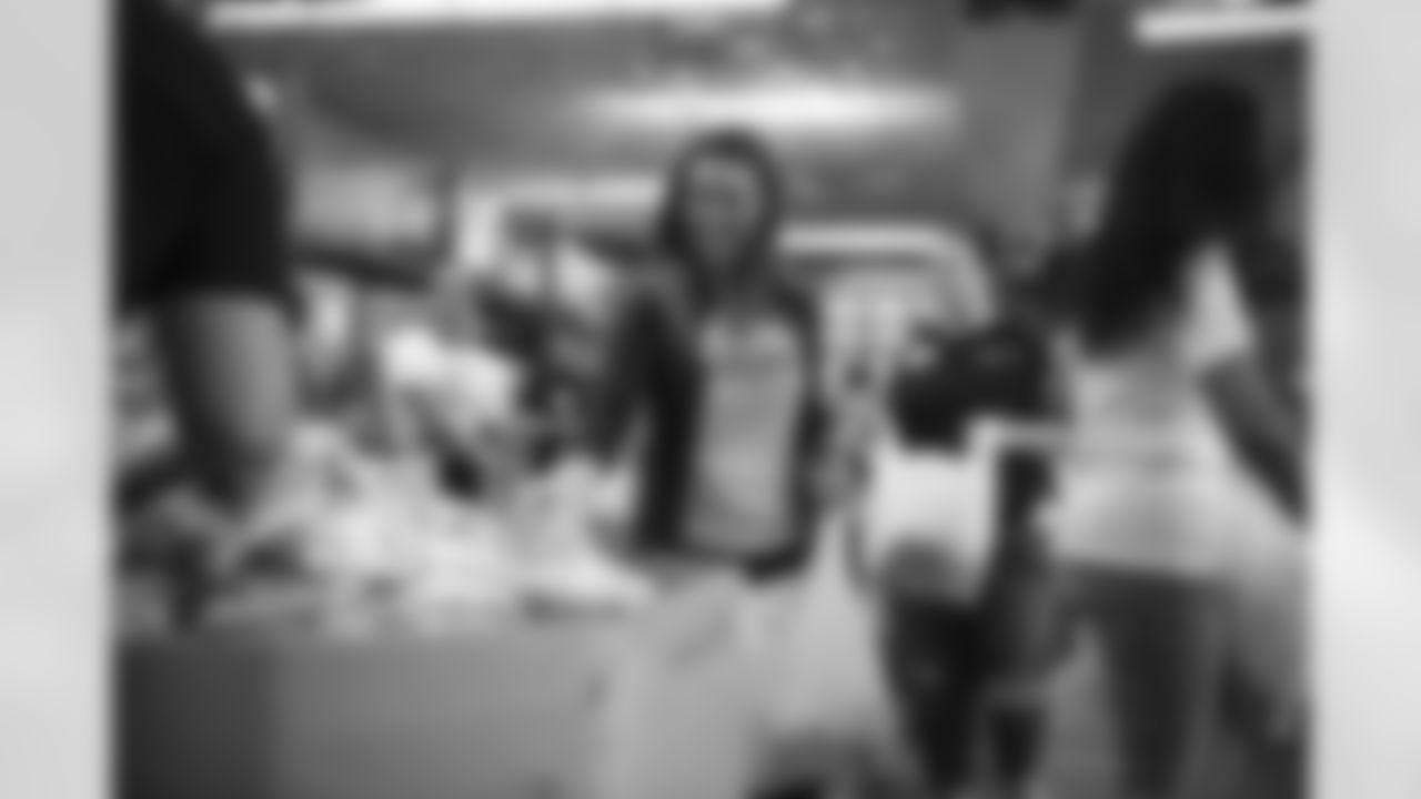 The Arizona Cardinals Women's Club packs emergency food bags at United Food Bank on Thursday, November 16, 2023 in Mesa, AZ.