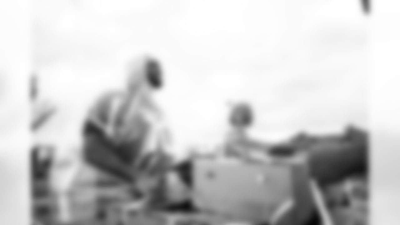 Arizona Cardinals offensive lineman Kelvin Beachum (68) and Arizona Cardinals offensive lineman Paris Johnson Jr. (70) host a food distribution for families at the Eisenhower Center for Innovation in collaboration with United Food Bank on Tuesday, Nov. 18, 2025 in Mesa, AZ.