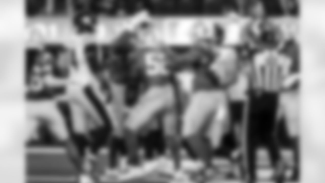 DL Da'Shawn Hand (91), OLB Khalil Mack (52) and OLB Tuli Tuipulotu (45)