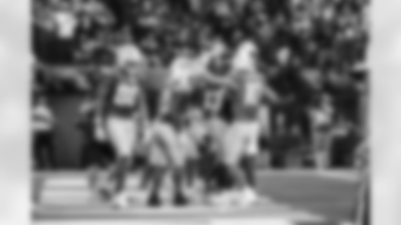 RB Kimani Vidal (30) and QB Justin Herbert (10)