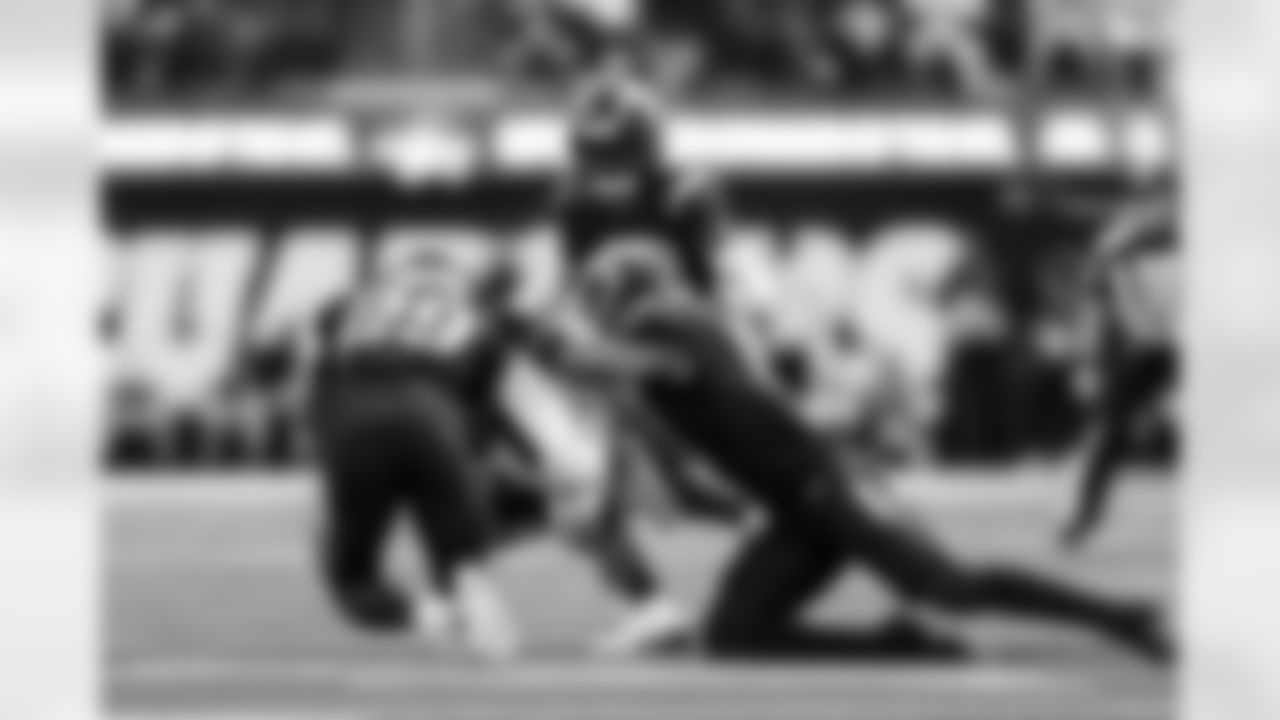 CB Tarheeb Still (29) and LB Daiyan Henley (0)