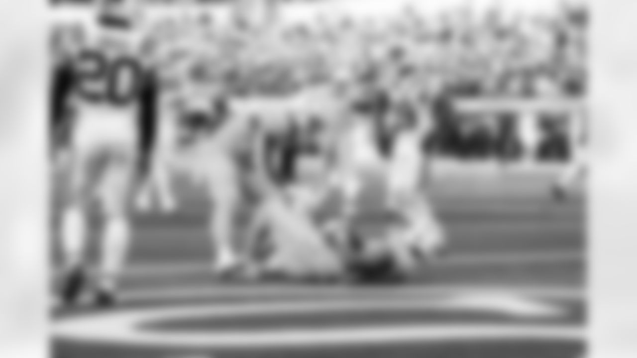 RB Hassan Haskins (28) and TE Oronde Gadsden (86)
