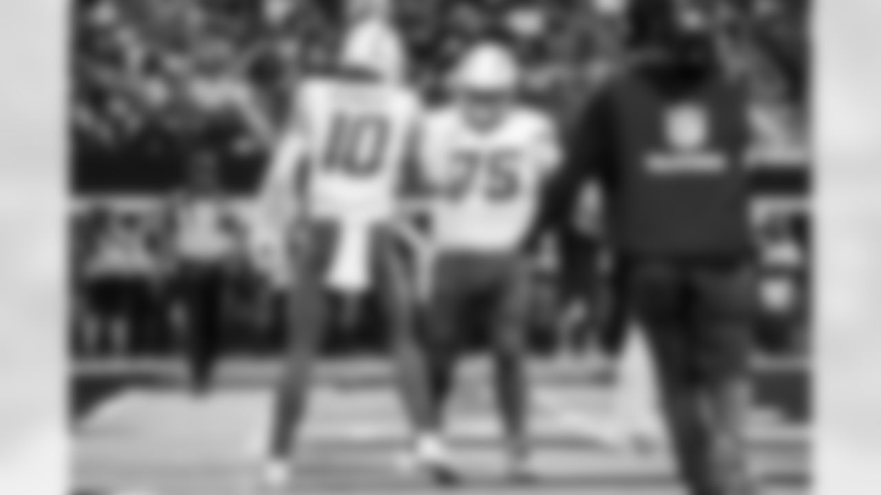 QB Justin Herbert (10) and C Bradley Bozeman (75)