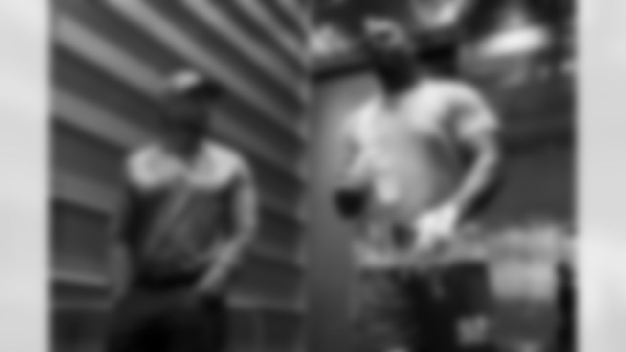 Special Teams Coordinator Ryan Ficken and DL Justin Eboigbe (92)