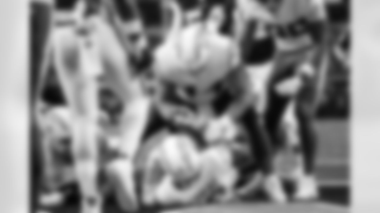 QB Justin Herbert (10) and DL Scott Matlock (44)