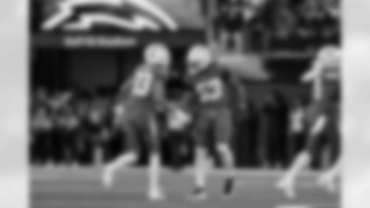 DB Deane Leonard (33) and LB Del'Shawn Phillips (53)