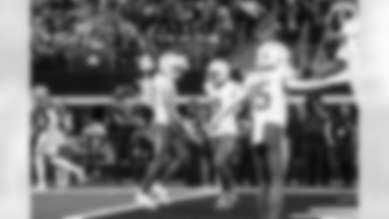 QB Justin Herbert (10) and WR Tre Harris (9)