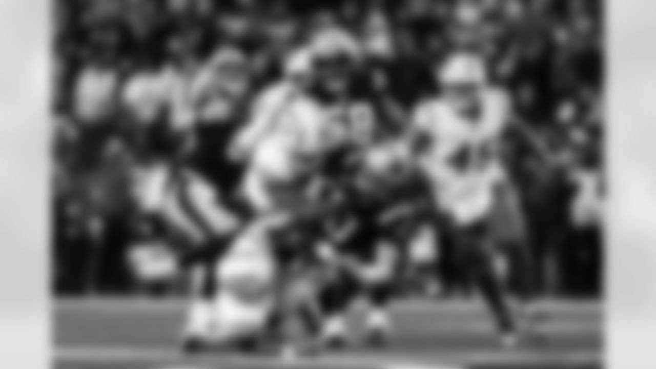 OLB Khalil Mack (52) and OLB Odafe Oweh (98)