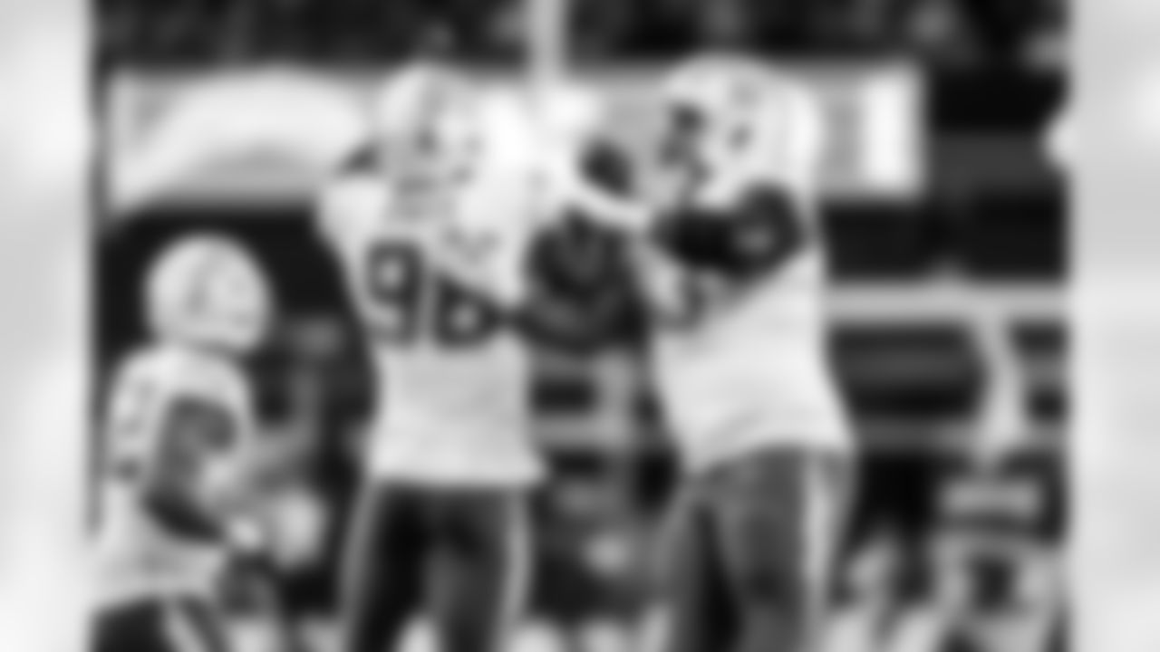 OLB Odafe Oweh (98) and DL Otito Ogbonnia (93)