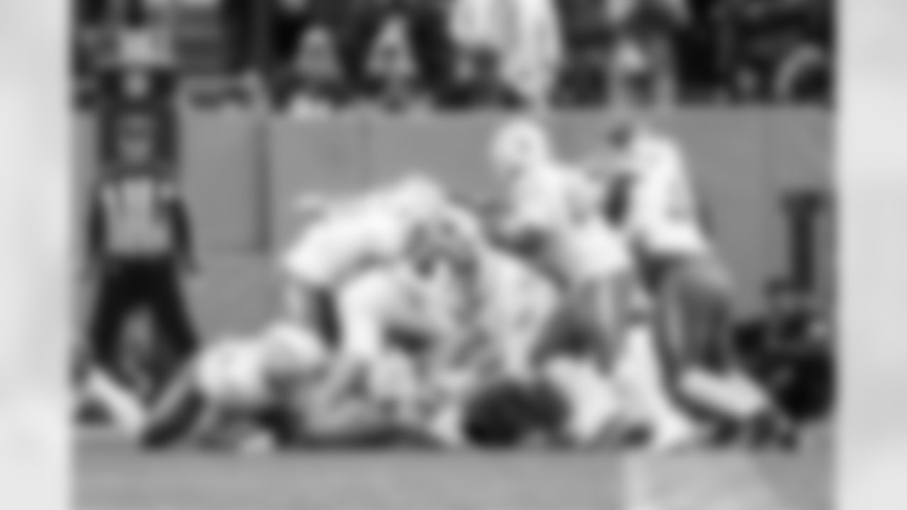 DB Elijah Molden (2) and DL Justin Eboigbe (92)