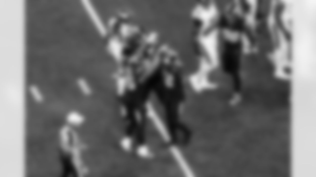 OLB Tuli Tuipulotu (45) and OLB Khalil Mack (52)