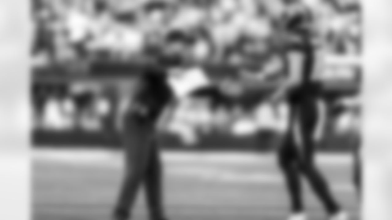 Head Coach Jim Harbaugh and QB Justin Herbert (10)