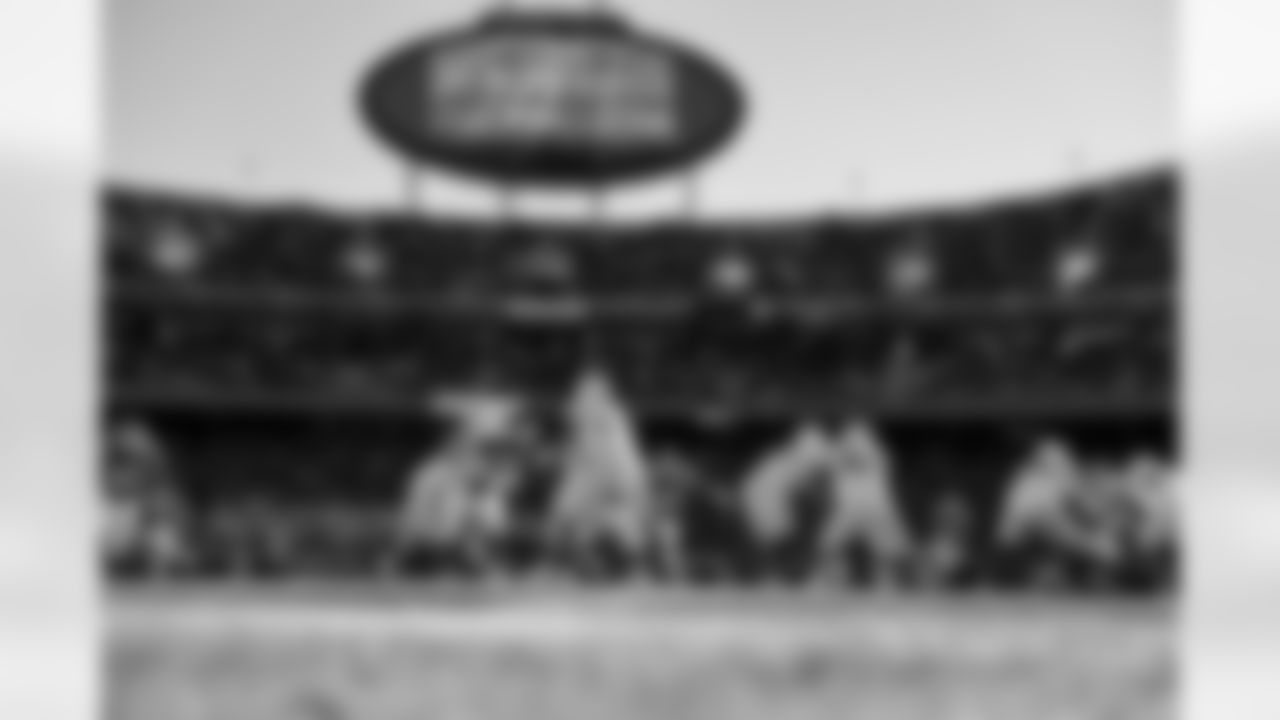 RB Kimani Vidal (30) and QB Justin Herbert (10)