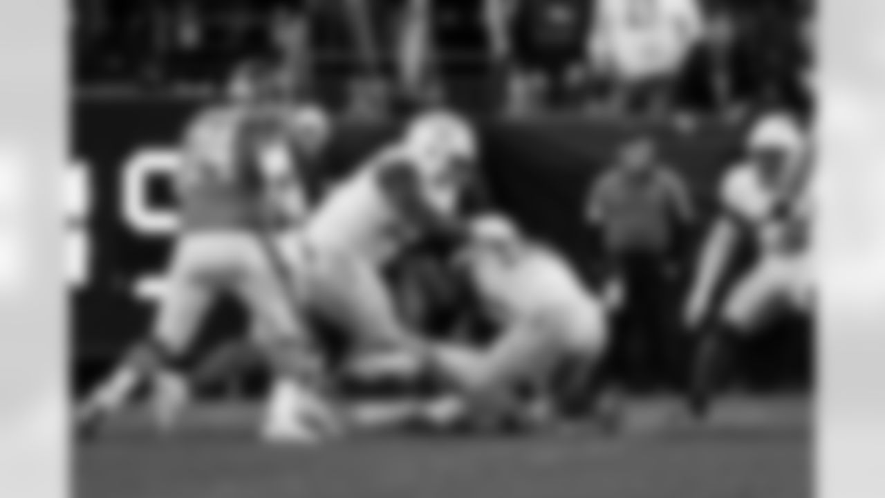 DL Otito Ogbonnia (93) and OLB Odafe Oweh (98)