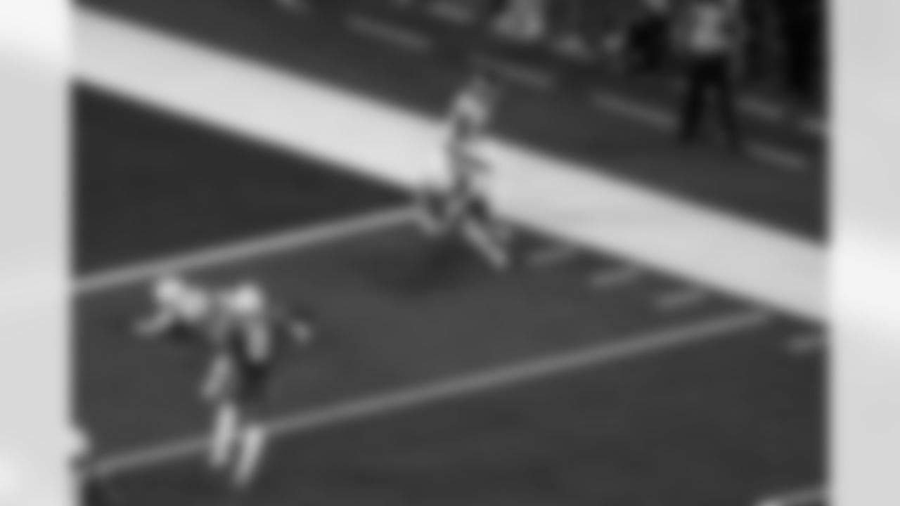 LB Daiyan Henley (0) and S Tony Jefferson (23)