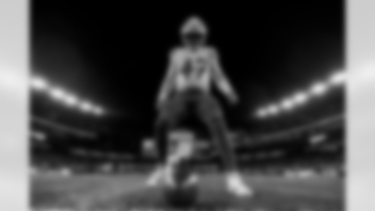 Check out the best shots from the Chargers Wild Card matchup against the Patriots!