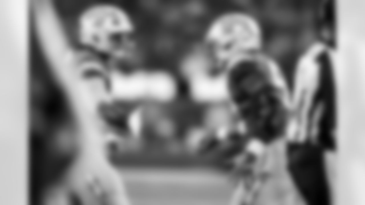 DL Justin Eboigbe (92) and OLB Khalil Mack (52)