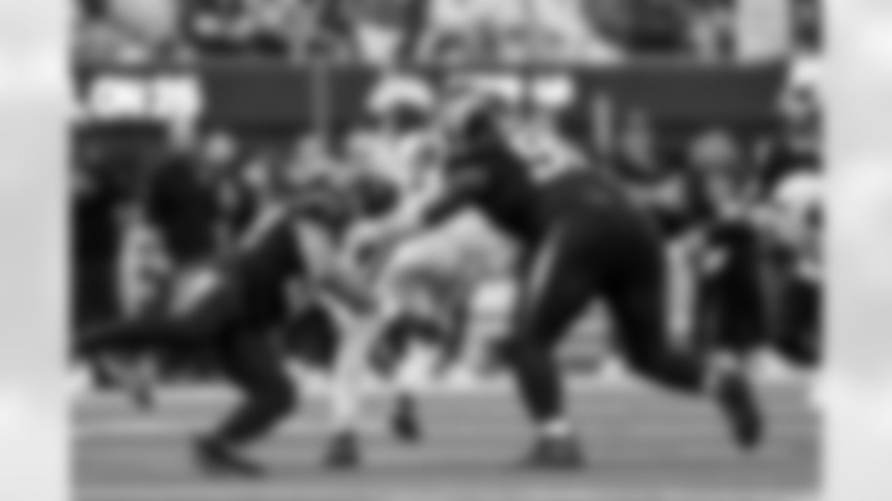 OLB Khalil Mack (52) and DL Teair Tart (90)