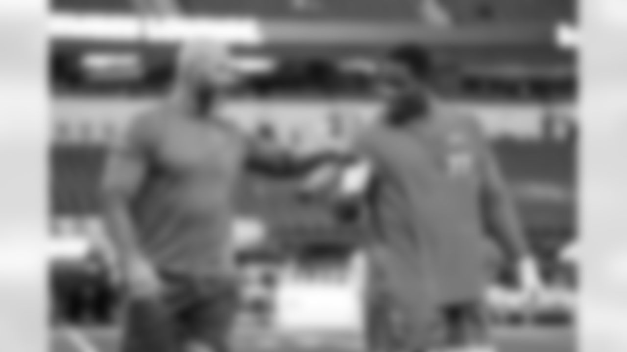 Assistant Offensive Line Coach Nick Hardwick and G Zion Johnson (77)