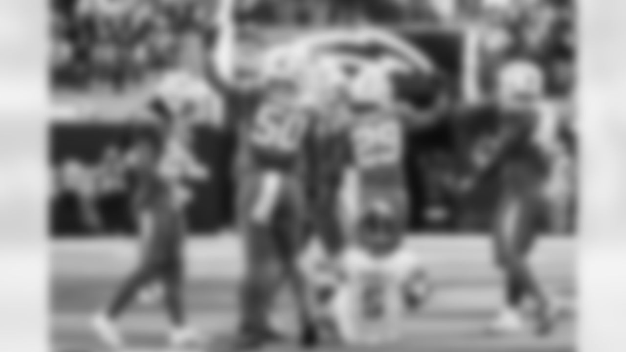 OLB Caleb Murphy (50) and CB Tarheeb Still (29)